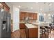 Spacious kitchen with stainless steel appliances, granite counters, and adjacent breakfast area at 5422 Shannon Bell Ln, Charlotte, NC 28277