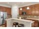 Well-lit kitchen with stainless steel appliances, breakfast bar, and mosaic tile backsplash at 5422 Shannon Bell Ln, Charlotte, NC 28277