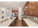 Bright kitchen featuring stainless steel appliances, wooden cabinets, and a breakfast bar at 5422 Shannon Bell Ln, Charlotte, NC 28277