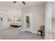 Spacious main bedroom featuring an exterior door, a ceiling fan, and plenty of natural light at 5422 Shannon Bell Ln, Charlotte, NC 28277