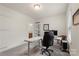 Carpeted home office with view to bathroom and second desk area at 5422 Shannon Bell Ln, Charlotte, NC 28277