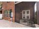 Charming patio features brick, screened entrance, seating area and access to rear entrance at 5422 Shannon Bell Ln, Charlotte, NC 28277