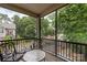 Relax on the screened-in porch with views of lush greenery and a tranquil setting at 5422 Shannon Bell Ln, Charlotte, NC 28277