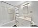 Compact bathroom featuring tub/shower, bright lighting, and vanity, maximizing functionality and space at 5573 Main St, Fort Lawn, SC 29714