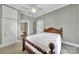 Serene bedroom with soft grey walls, neutral carpet, and a cozy bed, creating a peaceful retreat at 5573 Main St, Fort Lawn, SC 29714