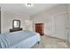 Comfortable bedroom with carpet, light blue walls, and classic wooden furniture at 5573 Main St, Fort Lawn, SC 29714