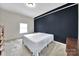 Bedroom featuring carpet, a dark accent wall, and minimalist decor at 5573 Main St, Fort Lawn, SC 29714