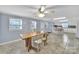 Bright dining area featuring tile floors, wood table, and white kitchen in background at 5573 Main St, Fort Lawn, SC 29714
