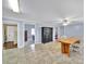 Open dining area with tile floors, a wood table, and black armoire at 5573 Main St, Fort Lawn, SC 29714
