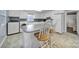 Bright kitchen featuring white cabinets, tile floors, eat-in island and laundry at 5573 Main St, Fort Lawn, SC 29714