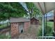 View of two outbuildings with brick and wood construction and a connecting brick pathway at 5573 Main St, Fort Lawn, SC 29714