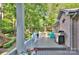 Enjoy outdoor living on the back porch with a grill, seating, and view of the yard at 6005 Bryant Ln, Waxhaw, NC 28173