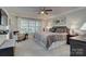 Cozy bedroom with a plush bed, soft lighting, and a relaxing window view at 6005 Bryant Ln, Waxhaw, NC 28173