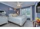 Charming bedroom with a white metal bed frame, neutral walls, and bright natural light at 6005 Bryant Ln, Waxhaw, NC 28173