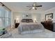 Inviting bedroom with a queen bed, soft neutral tones, and ample natural light at 6005 Bryant Ln, Waxhaw, NC 28173