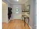 This bright foyer has wood floors, wainscoting, and a front door with decorative glass at 6005 Bryant Ln, Waxhaw, NC 28173