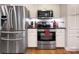 Modern kitchen featuring stainless steel appliances, white cabinets, and a clean, functional design at 6005 Bryant Ln, Waxhaw, NC 28173