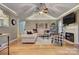 Inviting living room with vaulted ceilings, hardwood floors, a cozy fireplace, and stylish decor at 6005 Bryant Ln, Waxhaw, NC 28173