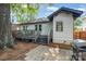 Exterior of the backyard featuring a deck with steps down to a patio and grill at 624 Oakland Ave, Charlotte, NC 28204