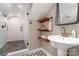 Modern bathroom includes a glass shower, custom shelving, and decorative mirror at 624 Oakland Ave, Charlotte, NC 28204