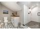 Modern bathroom includes a glass shower, custom shelving, and decorative tile flooring at 624 Oakland Ave, Charlotte, NC 28204