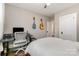 Bright bedroom includes hard wood floors, natural light, closet, and desk at 624 Oakland Ave, Charlotte, NC 28204