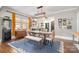 Elegant dining space with a bright window, seamlessly connected to the modern kitchen, and bright decor at 624 Oakland Ave, Charlotte, NC 28204