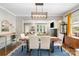 Charming dining room with stylish chandelier and a view into the cozy living area, perfect for gatherings at 624 Oakland Ave, Charlotte, NC 28204
