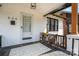 Charming front porch with a small table and chairs, perfect for relaxing at 624 Oakland Ave, Charlotte, NC 28204
