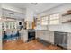 Stylish kitchen with granite countertops, stainless steel appliances, seamlessly connects to dining and living areas at 624 Oakland Ave, Charlotte, NC 28204