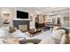 Stylish living room open to the dining area, featuring hardwood floors and a cozy fireplace at 624 Oakland Ave, Charlotte, NC 28204