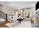 Open-concept living room with modern furnishings, hardwood floors, and plenty of natural light at 624 Oakland Ave, Charlotte, NC 28204