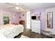 Cozy bedroom with hardwood floors and a spacious closet, perfect for relaxation at 6804 Lineberger Rd, Denver, NC 28037
