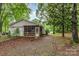 Exterior view of the home, featuring a fenced yard and a cozy porch at 6804 Lineberger Rd, Denver, NC 28037