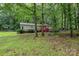 Exterior view of house with lush yard, green grass, and a driveway at 6804 Lineberger Rd, Denver, NC 28037