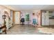Bright living space with light walls, neutral flooring, and ample room for multiple seating areas at 6804 Lineberger Rd, Denver, NC 28037