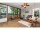 Screened porch with a variety of seating options overlooking the fenced yard at 6804 Lineberger Rd, Denver, NC 28037