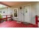 Welcoming front porch with red railing, white door, and space for seating and decor at 6804 Lineberger Rd, Denver, NC 28037