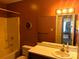 Full bathroom featuring a bath, sink, neutral wall and a well-lit mirror at 711 4Th Sw Ave # B3, Conover, NC 28613