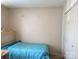 Bedroom with light pink walls featuring a bed and a closet with white doors at 711 4Th Sw Ave # B3, Conover, NC 28613