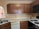 Functional kitchen with essential appliances, countertops, cabinets, and tiled backsplash at 711 4Th Sw Ave # B3, Conover, NC 28613