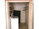 Well-organized laundry closet featuring a washer, dryer, shelving, and ample storage space at 711 4Th Sw Ave # B3, Conover, NC 28613