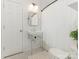 Classic bathroom featuring a pedestal sink, subway tile, and charming fixtures at 716 Ellsworth Rd, Charlotte, NC 28211