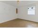 Clean bedroom with hardwood floors, bright light fixture, and built in storage spaces at 716 Ellsworth Rd, Charlotte, NC 28211