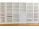 Custom white built-in shelving with ample storage space in a neutral-toned room at 716 Ellsworth Rd, Charlotte, NC 28211