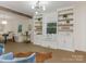 Bright living room with custom built-ins and a cozy window seat, perfect for relaxing and enjoying the view at 716 Ellsworth Rd, Charlotte, NC 28211