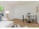 Bright living room featuring hardwood floors, modern decor, and natural light from a window at 716 Ellsworth Rd, Charlotte, NC 28211