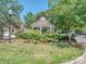 Charming community gazebo with flowering plants at 7722 Springs Village Ln # 40, Charlotte, NC 28226
