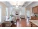 Open-concept living space with coffered ceilings, fireplace, and hardwood flooring at 7722 Springs Village Ln # 40, Charlotte, NC 28226