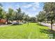 Beautiful street view with lush green lawns and tree-lined street at 7722 Springs Village Ln # 40, Charlotte, NC 28226